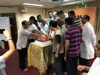 Our Fathers joining their hands together for cake cutting for Father's day